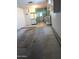 A spacious basement awaits refinishing with bright cabinets and an entryway to the backyard at 11012 W Caron Dr, Sun City, AZ 85351
