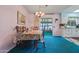 Cozy dining area with traditional furniture and sliding glass doors to the patio at 11012 W Caron Dr, Sun City, AZ 85351