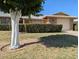 Charming single-story home featuring a well-manicured lawn and a trimmed hedge for added curb appeal at 11012 W Caron Dr, Sun City, AZ 85351