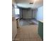 A spacious garage features an automatic door, storage cabinets, and an entryway to the basement at 11012 W Caron Dr, Sun City, AZ 85351