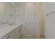 Modern bathroom with quartz countertops, single sink, and large mirror at 11300 N Casa Dega N Dr # 1047, Surprise, AZ 85388