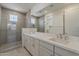 Bathroom features dual sinks, quartz countertops and a tiled shower at 11300 N Casa Dega N Dr # 1047, Surprise, AZ 85388