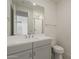 Bathroom featuring a large mirror and white cabinets at 11300 N Casa Dega N Dr # 1047, Surprise, AZ 85388