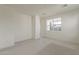 Light-filled bedroom features carpet flooring and neutral paint at 11300 N Casa Dega N Dr # 1047, Surprise, AZ 85388