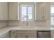 Contemporary kitchen featuring quartz countertops, white cabinets, and stainless steel appliances at 11300 N Casa Dega N Dr # 1047, Surprise, AZ 85388