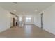 Spacious living room featuring hardwood floors, abundant natural light, and open concept kitchen at 11300 N Casa Dega N Dr # 1047, Surprise, AZ 85388