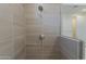 Shower stall featuring gray tiled walls and chrome showerhead at 11300 N Casa Dega N Dr # 1047, Surprise, AZ 85388