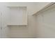 Bright walk-in closet with built-in shelves, carpet flooring at 11300 N Casa Dega N Dr # 1047, Surprise, AZ 85388