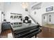 Bright living room with high ceilings, a grand piano, and a staircase with white railings at 11959 W Vernon Ave, Avondale, AZ 85392