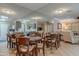 Dining area featuring multiple wood tables and chairs plus large mirrored wall at 14300 W Bell Rd # 58, Surprise, AZ 85374