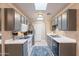 Well-lit kitchen features stainless appliances, white countertops and gray cabinets at 14300 W Bell Rd # 58, Surprise, AZ 85374