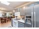 Well-equipped kitchen featuring gray cabinets, white countertops, and stainless steel appliances at 14300 W Bell Rd # 58, Surprise, AZ 85374