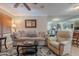 Comfortable living room showcasing a soft color palette, and large mirror at 14300 W Bell Rd # 58, Surprise, AZ 85374