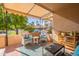 Comfortable covered patio with outdoor furniture with views of the community pool at 14300 W Bell Rd # 58, Surprise, AZ 85374
