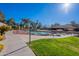 Beautiful community area featuring a serene pond with lush landscaping and walking paths at 14300 W Bell Rd # 58, Surprise, AZ 85374