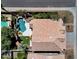 A private backyard featuring a sparkling pool, waterfall feature, lush landscaping, artificial turf, and space for outdoor dining at 14823 S 13Th Pl, Phoenix, AZ 85048