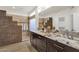 Well-lit bathroom with granite counters, double sinks, and a step-up tiled shower at 14823 S 13Th Pl, Phoenix, AZ 85048