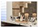Close up of a double sink vanity featuring a granite countertop, decor and a view of the shower at 14823 S 13Th Pl, Phoenix, AZ 85048