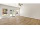 Bright bedroom with neutral tones, wood-look floors, with backyard access and a pool view at 14823 S 13Th Pl, Phoenix, AZ 85048
