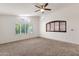 A bright bedroom featuring vaulted ceilings and decorative windows providing plenty of natural light at 14823 S 13Th Pl, Phoenix, AZ 85048