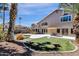 Rear exterior featuring a spacious patio area, backyard with lush turf, and a sparkling pool view at 14823 S 13Th Pl, Phoenix, AZ 85048