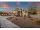 Inviting two-story home boasts desert landscaping, a three-car garage and mountain views at 14823 S 13Th Pl, Phoenix, AZ 85048