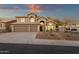 Inviting two-story home boasts desert landscaping, a three-car garage and mountain views at 14823 S 13Th Pl, Phoenix, AZ 85048
