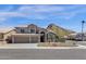 Inviting two-story home boasts desert landscaping, a three-car garage and mountain views at 14823 S 13Th Pl, Phoenix, AZ 85048