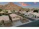 Stunning two-story home boasts a tile roof, three-car garage, and a backdrop of picturesque mountain views at 14823 S 13Th Pl, Phoenix, AZ 85048