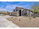 Inviting two-story home boasts desert landscaping, a three-car garage and mountain views at 14823 S 13Th Pl, Phoenix, AZ 85048