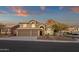 Inviting two-story home boasts desert landscaping, a three-car garage and mountain views at 14823 S 13Th Pl, Phoenix, AZ 85048