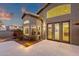 Rear exterior showcasing spacious patio, lush landscaping, and seamless indoor-outdoor living at 14823 S 13Th Pl, Phoenix, AZ 85048