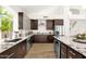 Beautiful kitchen with granite countertops, stainless steel appliances, undermount sink and ample cabinet space at 14823 S 13Th Pl, Phoenix, AZ 85048
