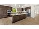 Spacious kitchen features a large island, granite countertops, stainless steel appliances, and ample cabinet space at 14823 S 13Th Pl, Phoenix, AZ 85048