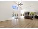 Bright room with backyard view, high ceilings, large windows, and kitchen access at 14823 S 13Th Pl, Phoenix, AZ 85048