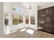 Bright room showcasing backyard pool view with large windows and high ceilings, creating airy ambiance at 14823 S 13Th Pl, Phoenix, AZ 85048