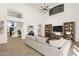 Comfortable staged living room showing the wet bar, soaring ceiling, and ample light at 14823 S 13Th Pl, Phoenix, AZ 85048