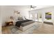 Well-staged main bedroom features wood floors, bright light, and access to the backyard at 14823 S 13Th Pl, Phoenix, AZ 85048