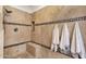Beautifully tiled shower featuring a bench, niche, mosaic accents and a rainfall shower head at 14823 S 13Th Pl, Phoenix, AZ 85048