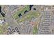 Aerial view of a residential area with golf course and community amenities, nestled within a well-planned neighborhood at 17332 W Wildwood St, Surprise, AZ 85388