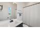 Modern bathroom featuring a sleek vanity, stylish fixtures, and a shower with a curtain at 17332 W Wildwood St, Surprise, AZ 85388