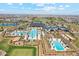 Aerial view of community pools, offering residents a refreshing oasis with palm trees and recreational spaces at 17332 W Wildwood St, Surprise, AZ 85388
