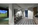 This luxury home feature includes a bar and a golf simulator for at home practice at 17332 W Wildwood St, Surprise, AZ 85388