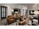 Inviting living room area with cozy seating, fireplace, and stylish decor at 17332 W Wildwood St, Surprise, AZ 85388