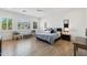 Serene main bedroom featuring shuttered windows, tile floors, and a soothing color scheme at 17332 W Wildwood St, Surprise, AZ 85388