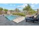 Backyard pool featuring a built-in spa and ample patio space perfect for relaxing or entertaining at 17332 W Wildwood St, Surprise, AZ 85388