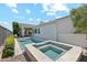 Backyard oasis with a pool, hot tub, and covered patio, perfect for outdoor living and entertaining at 17332 W Wildwood St, Surprise, AZ 85388