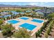 Aerial view of community sport courts for tennis, basketball, and pickleball with mountain views at 17332 W Wildwood St, Surprise, AZ 85388