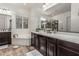 Luxurious bathroom featuring a soaking tub, double vanity, and glass-enclosed shower at 19571 E Strawberry Dr, Queen Creek, AZ 85142