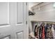 Walk-in closet with built in shelving and hanging racks for optimal storage space at 19571 E Strawberry Dr, Queen Creek, AZ 85142